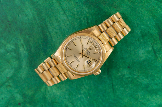 Rolex Day-Date 36 18078 Bark Bezel Yellow Gold Silver Dial 1981 - 36mm President dress watch with textured bark finish front view