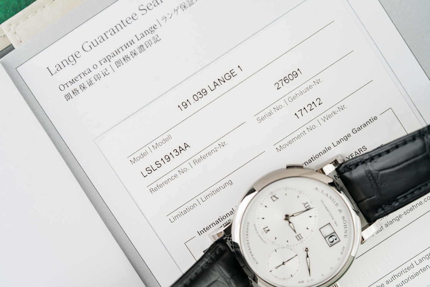 A Lange Sohne Lange 1 191.039 Silver Dial Crown Side - The Watch Business Sydney