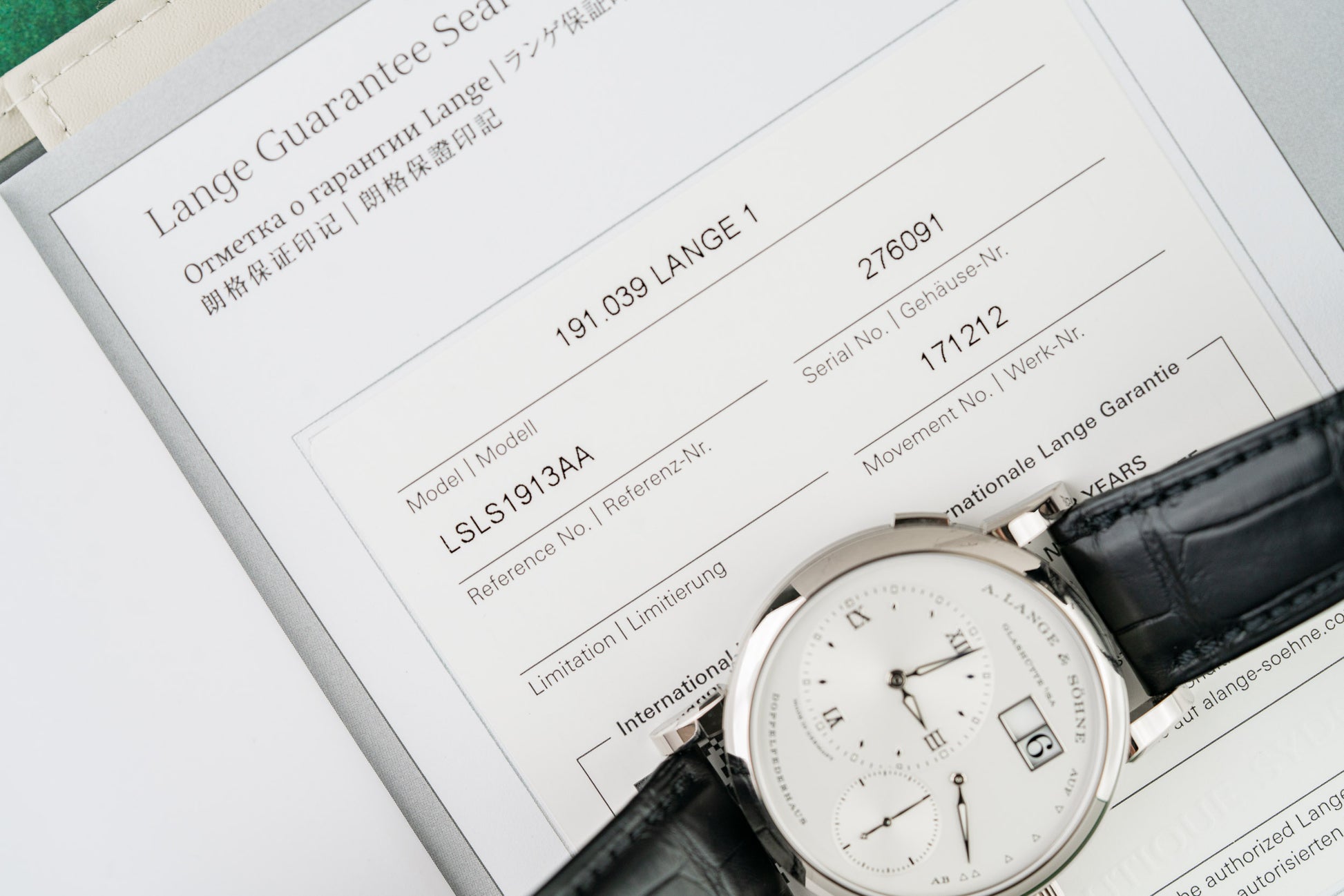 A Lange Sohne Lange 1 191.039 Silver Dial Crown Side - The Watch Business Sydney