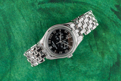 Patek Philippe Annual Calendar 5036/1G Black Roman Dial 18k White Gold Bracelet - The Watch Business Sydney