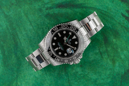 Rolex GMT-Master II 116710LN stainless steel watch with black dial, green GMT hand, and ceramic bezel