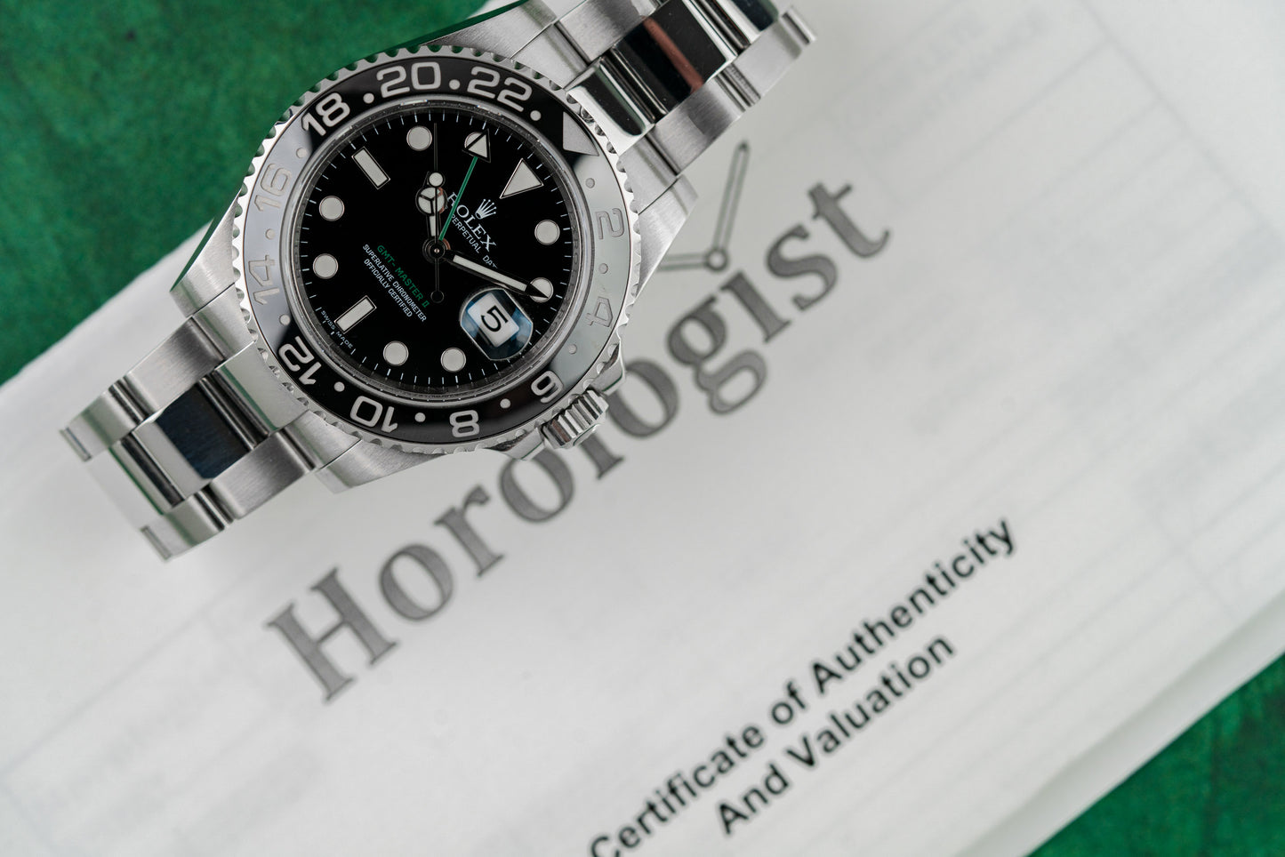 Rolex GMT-Master II 116710LN stainless steel watch with black dial, green GMT hand, and ceramic bezel