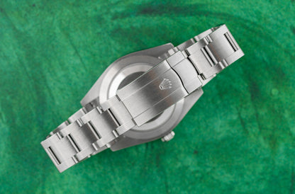 Rolex Oyster Perpetual 41 Green Dial 124300 case and crown - The Watch Business