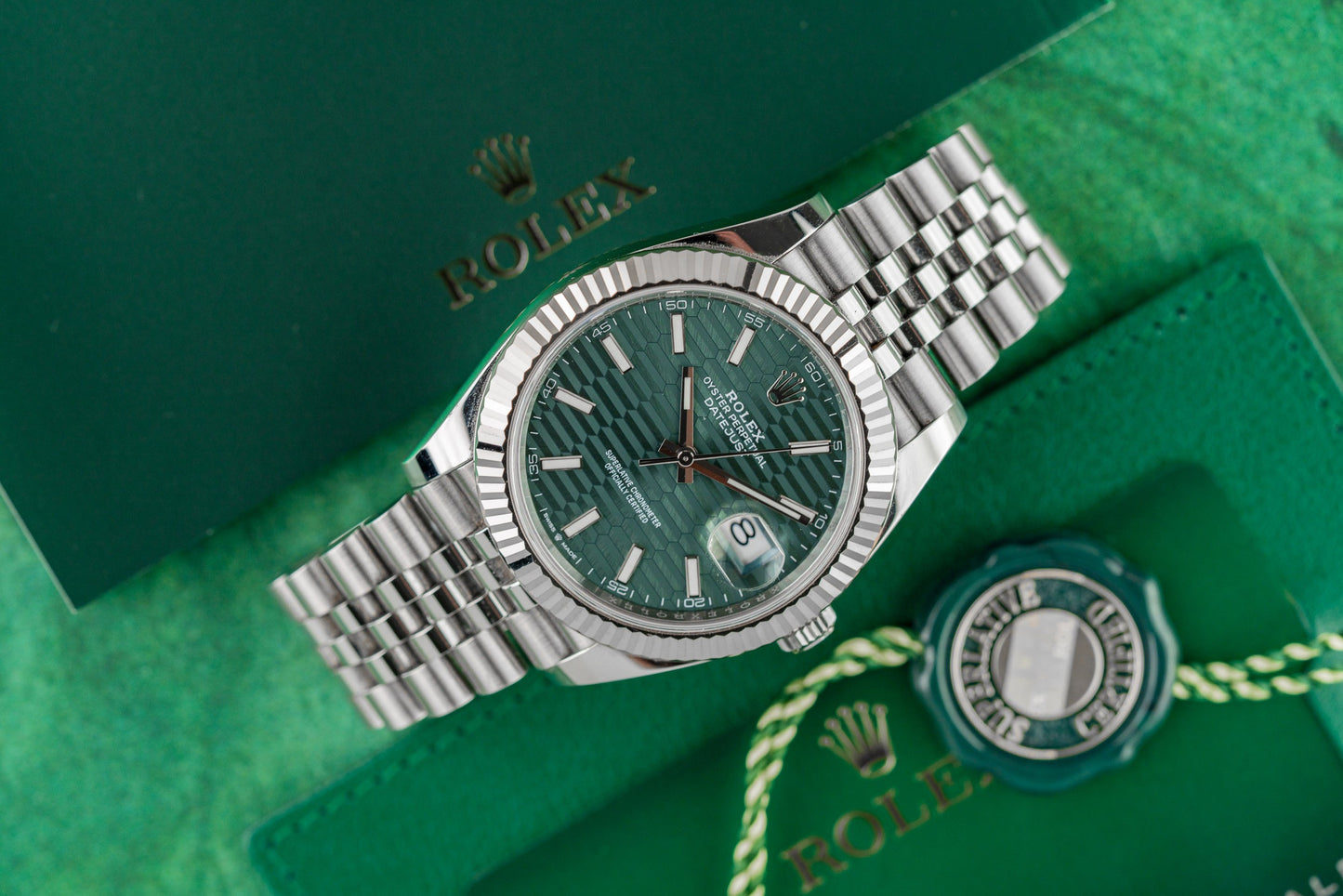 Rolex Datejust 41 126334 Green Motif Dial White Gold Fluted Bezel Case - The Watch Business Sydney CBD