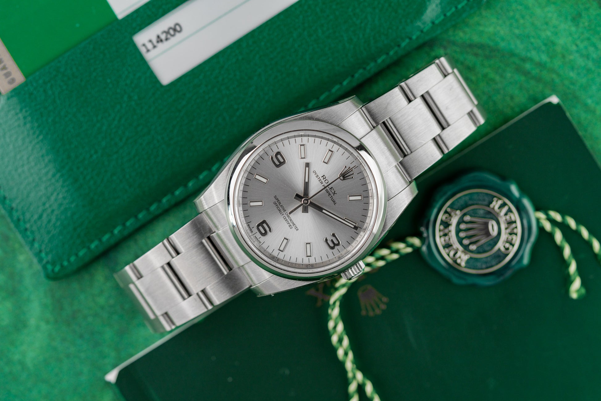 Rolex Oyster Perpetual 34 114200 Silver Dial Stainless Steel Case with Stickers - The Watch Business Sydney CBD