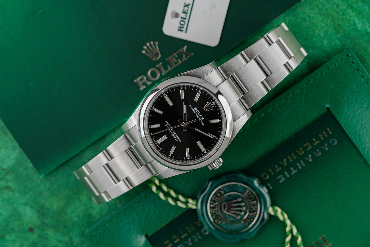 Rolex Oyster Perpetual 34 124200 Black Dial Smooth Bezel Case - The Watch Business Sydney CBD